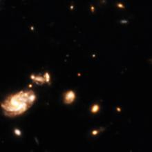In una delle immagini a campo profondo del JWST si vede un minuscolo punto rosso (al centro) la cui identità è misteriosa. Collaborazione Giuseppe Capriotti e Giovanni Gandolfi/CEERS; NASA/ESA/CSA